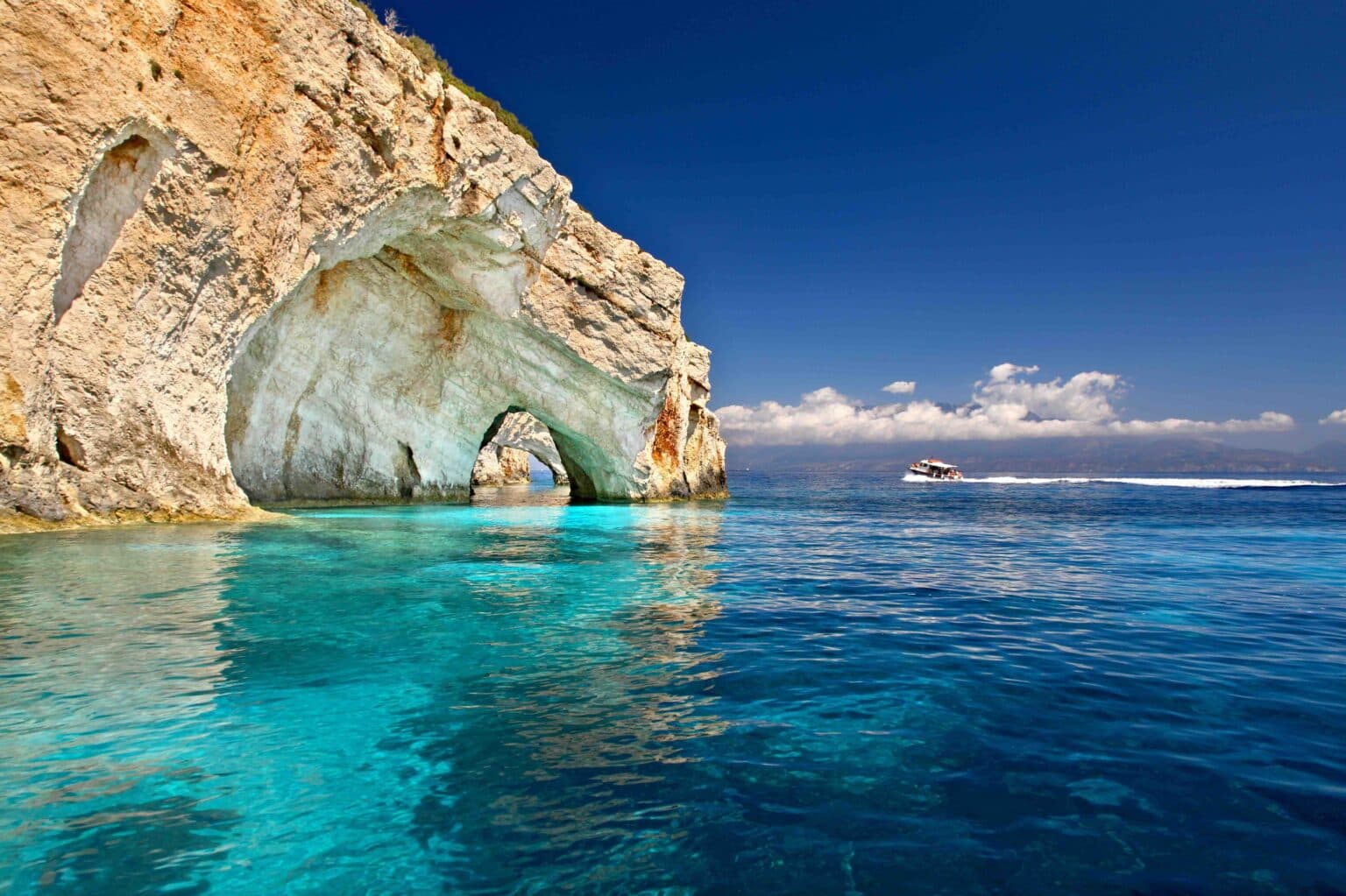 Sunlit Ionian coastline in Greece